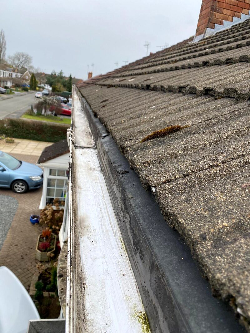 The same gutter emptied and flushed after cleaning